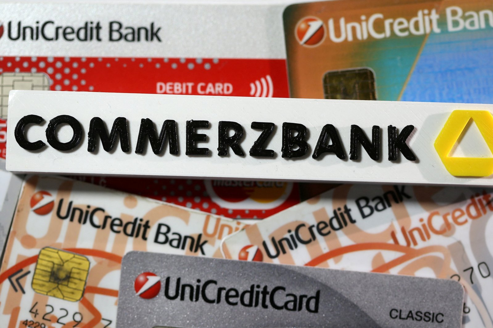 A 3-D printed Commerzbank logo is seen near Unicredit credit cards in this illustration taken on Sept. 20, 2017. (Reuters Photo)