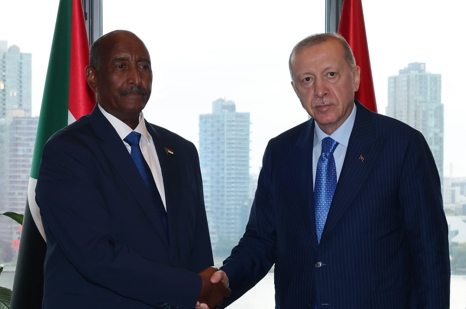 President Recep Tayyip Erdoğan and Abdel Fattah al-Burhan shake hands at Turkish House in New York, Sept. 25, 2024. (AA Photo)