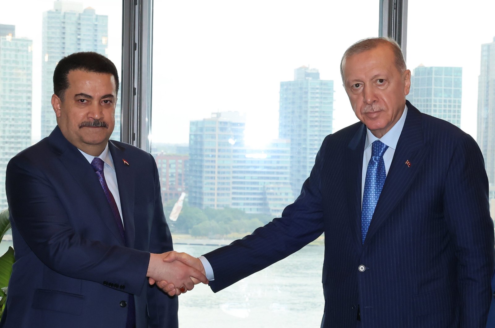 President Recep Tayyip Erdoğan and Iraqi PM Mohammed S. al-Sudani shake hands after a meeting in New York, Sept. 25, 2024. (AA Photo)