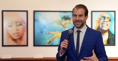 Photographer Pari Dukovic addresses journalists during the opening of his first solo exhibition in Türkiye, titled "From Istanbul to New York: A Photographer's Journey," Istanbul, Türkiye, Sept. 25, 2024. (AA Photo)