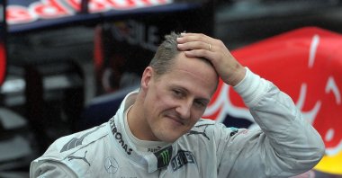 German Formula One driver Michael Schumacher gestures at the end of the Brazil&#039;s F1 GP at the Interlagos racetrack, Sao Paulo, Brazil, Nov. 25, 2012. (AFP Photo)