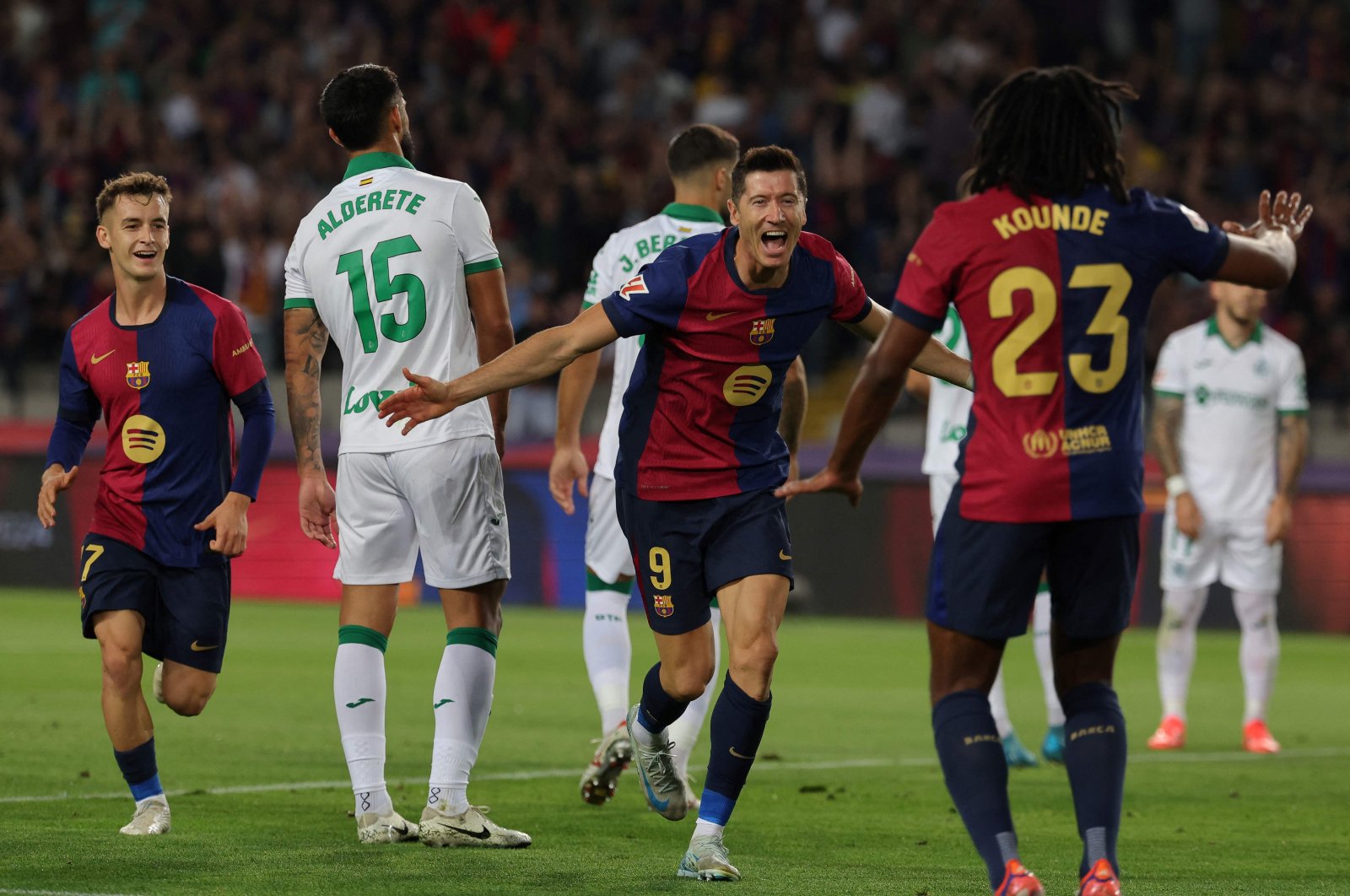 Barcelona&#039;s Robert Lewandowski (C) celebrates after scoring his team&#039;s first goal during the La Liga match against Getafe at the Estadi Olimpic Lluis Companys, Barcelona, Spain, Sept. 25, 2024. (AFP Photo)