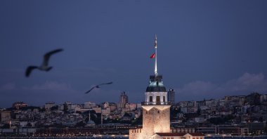 Seagulls fly around Maiden's Tower on the Bosporus during sunrise in Istanbul, Türkiye, Sept. 18, 2024. (EPA Photo)