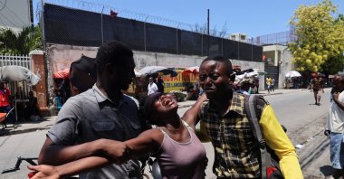 A woman is helped by others as she reacts upon seeing the dead body of her brother who was shot dead by unknown assailants, Port-au-Prince, Haiti, Sept. 9, 2024. (Reuters Photo)