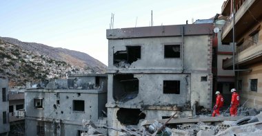 Rescuers check the destruction following an overnight Israeli airstrike, Shebaa, Lebanon, Sept. 27, 2024. (AFP Photo)