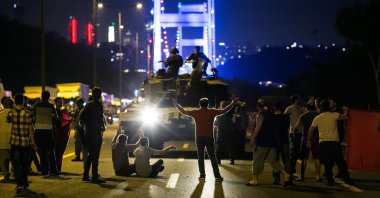 People take over a tank hijacked by FETÖ infiltrators during the coup attempt in Istanbul, Türkiye, July 16, 2016. (AFP Photo)