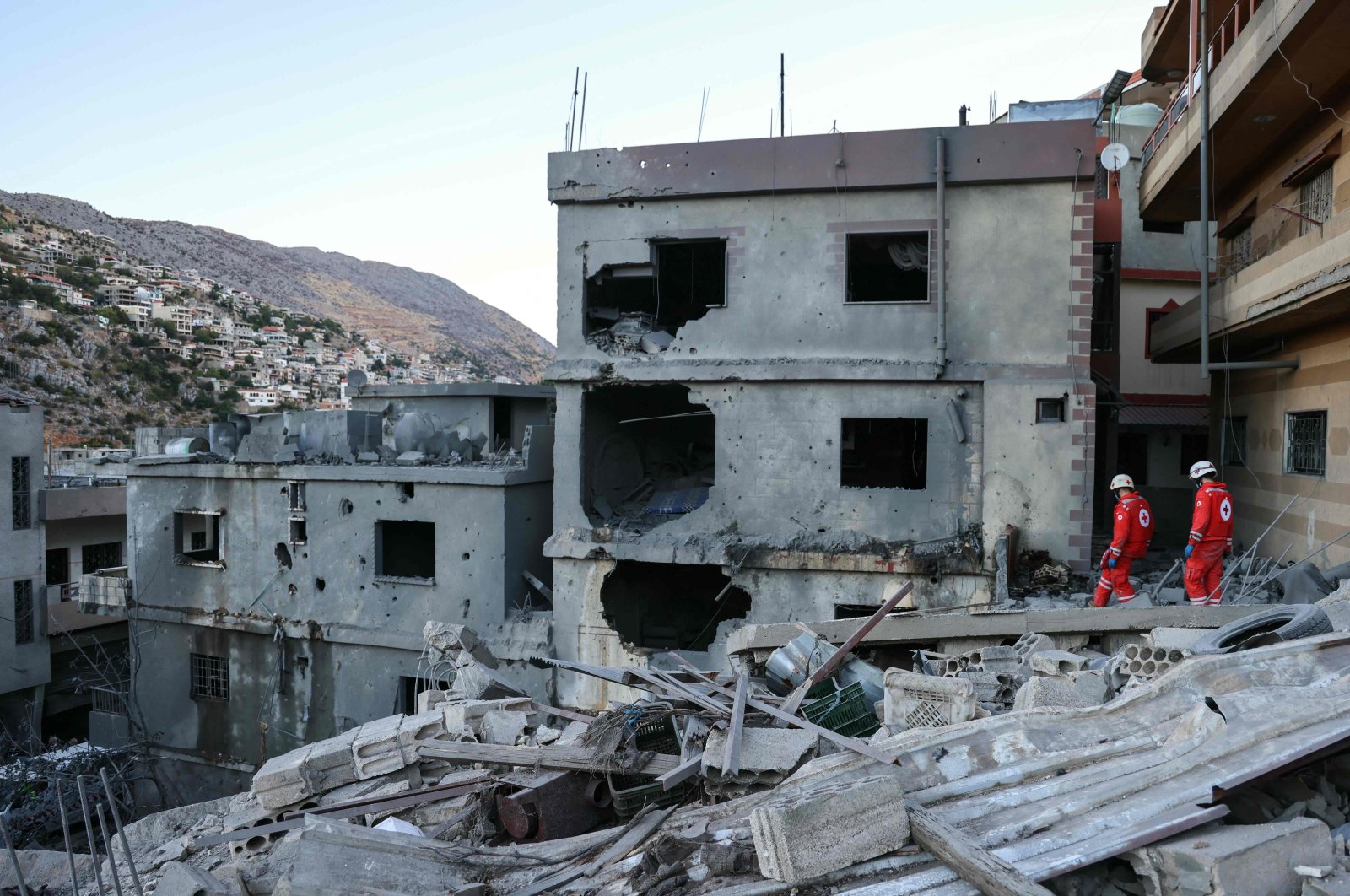 Rescuers check the destruction following an overnight Israeli airstrike, Shebaa, Lebanon, Sept. 27, 2024. (AFP Photo)