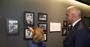 Culture and Tourism Minister Mehmet Nuri Ersoy (R) visits the exhibition on Türker Inanoğlu, in Istanbul, Türkiye, Sept. 27, 2024. (AA Photo)