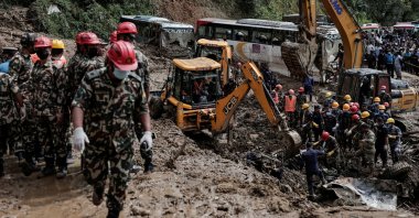 Rescue personnel work to retrieve bodies from a landslide triggered by heavy rainfall, in Dhading, Nepal, Sept. 29, 2024. (Reuters Photo)