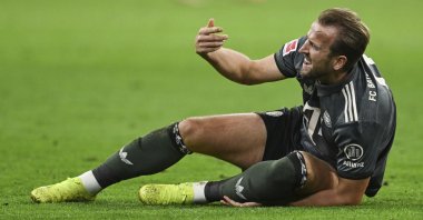 Bayern Munich's Harry Kane lies on the pitch in pain during a Bundesliga match against Leverkusen, in Munich, Germany, Sept. 28, 2024. (AP Photo)
