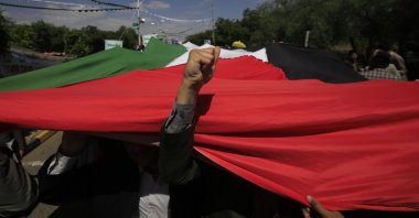 Students carry a Palestinian flag during a protest in solidarity with the Palestinian people, Sana'a, Yemen, Sept. 25, 2024. (EPA Photo)