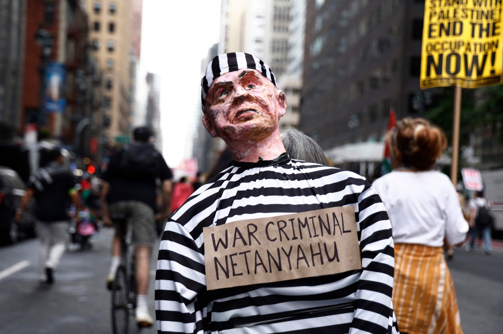 A person holds an effigy of a man reading &quot;war criminal Netanyahu&quot; as pro-Palestinian protesters march through the streets of New York as a part of a city-wide protest against Israeli Prime Minister Benjamin Netanyahu, New York, U.S., Sept. 26, 2024. (AFP Photo)