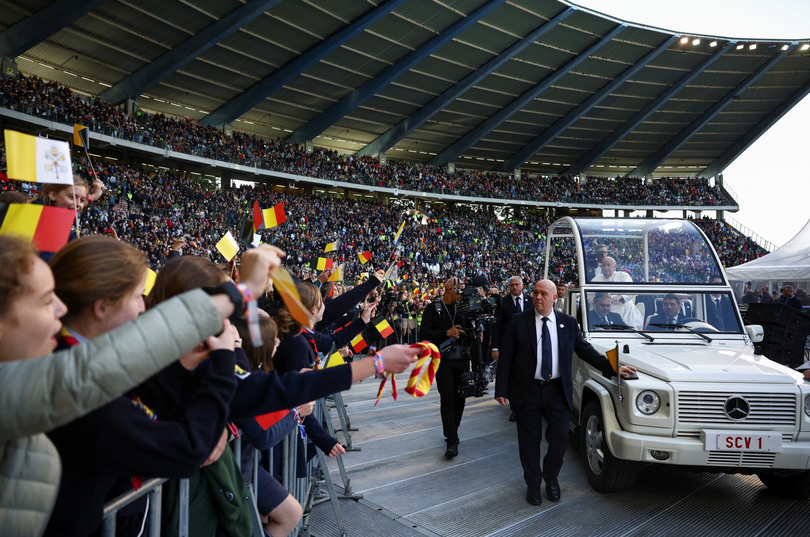 Pope Francis greets the crowd as he arrives to attend a Holy Mass at King Baudouin Stadium in Brussels, Belgium, Sept. 29, 2024. (Reuters Photo)