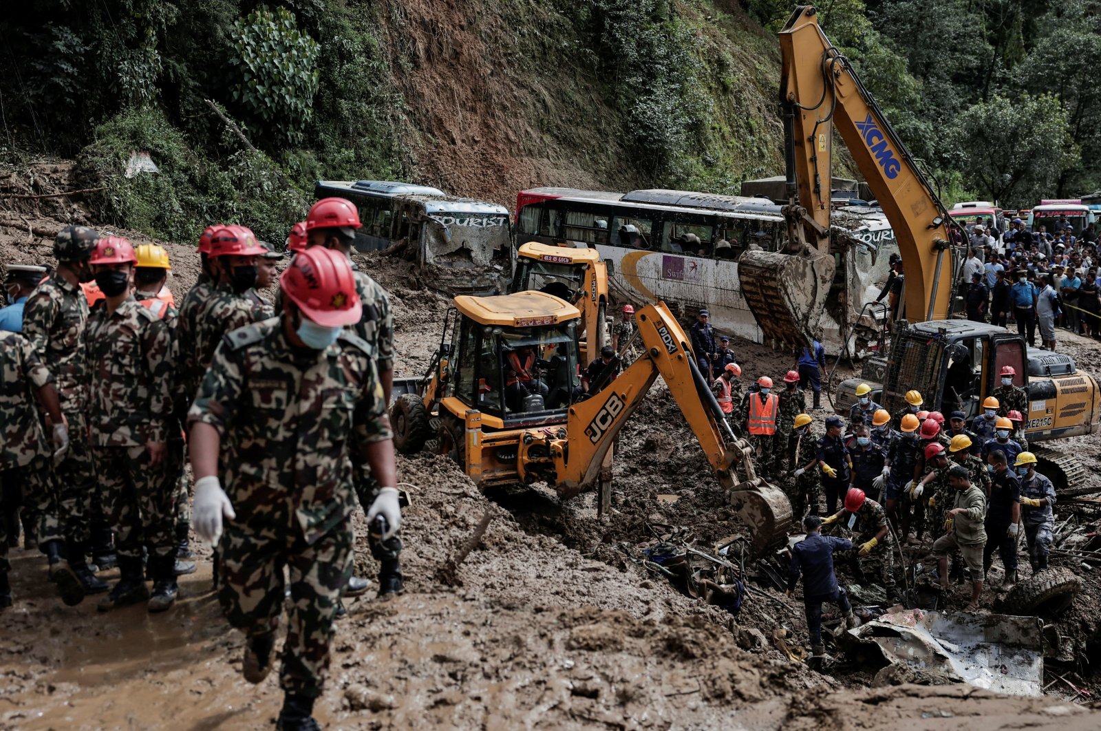 Rescue personnel work to retrieve bodies from a landslide triggered by heavy rainfall, in Dhading, Nepal, Sept. 29, 2024. (Reuters Photo)