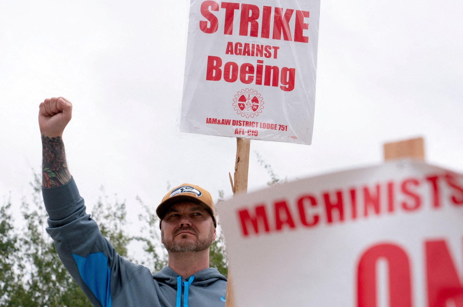 A Boeing factory worker raises a fist at a picket line during the third day of a strike near the entrance to a Boeing production facility, Renton, Washington, U.S. Sept. 15, 2024. (Reuters Photo)