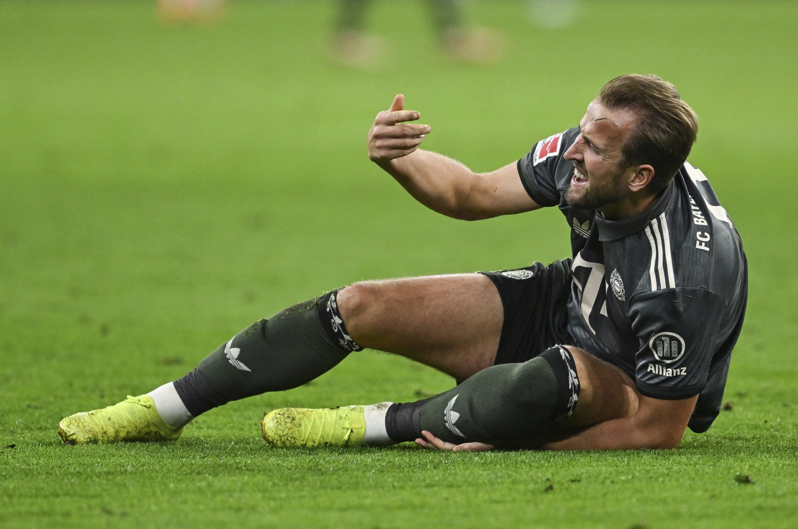 Bayern Munich&#039;s Harry Kane lies on the pitch in pain during a Bundesliga match against Leverkusen, in Munich, Germany, Sept. 28, 2024. (AP Photo)