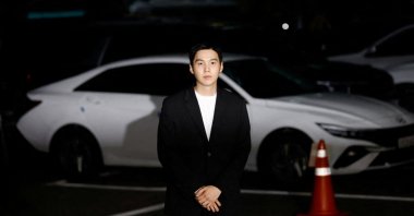 Suga of the K-pop boy band BTS arrives at a police station for questioning regarding his drunk driving charge, in Seoul, South Korea, Aug. 23, 2024. (Reuters Photo)