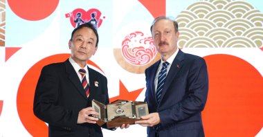 Enver Iskurt, Türkiye&#039;s deputy transport and infrastructure minister (R), presents a gift to Japan&#039;s Ambassador to Ankara Katsumata Takahiko (L), during a ceremony to celebrate the centenary of Turkish-Japanese diplomatic relations in Istanbul, Türkiye, Sept. 29, 2024. (AA Photo)