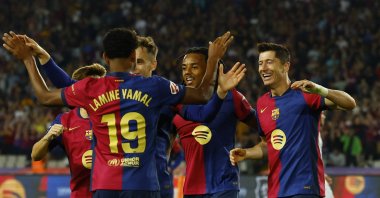 Barcelona's Robert Lewandowski (R) celebrates with his teammates after scoring a goal during the La Liga match against Getafe at the Estadi Olimpic Lluis Companys, Barcelona, Spain, Sept. 25, 2024. (AFP Photo)