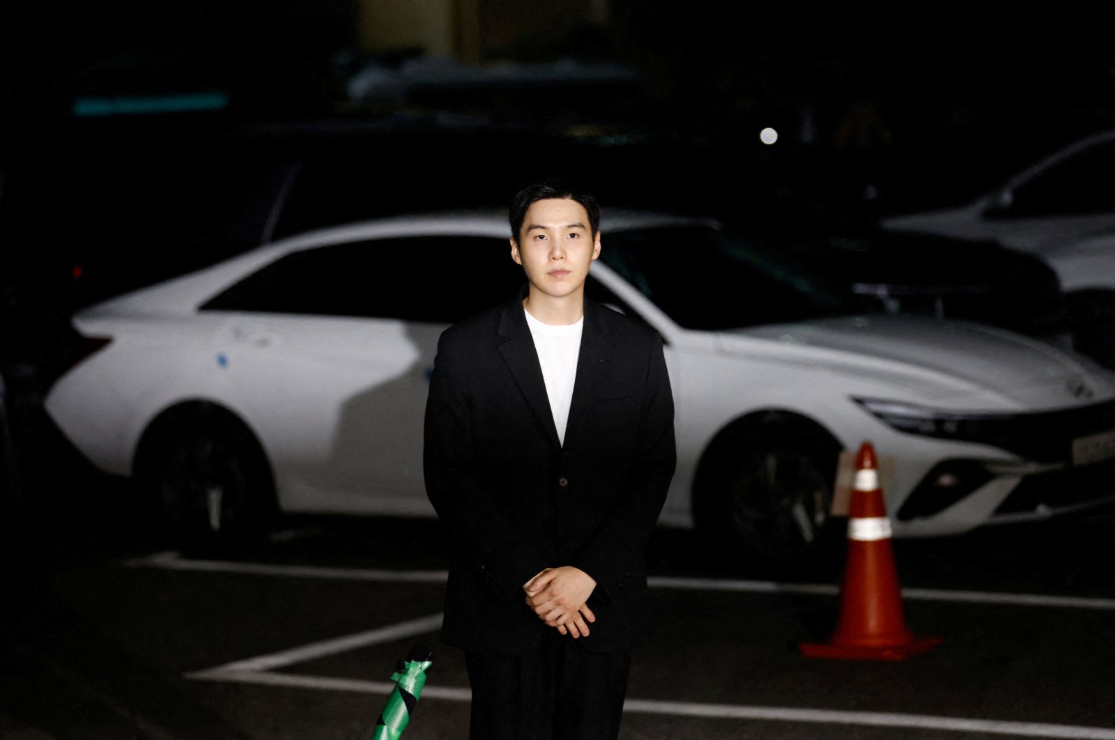 Suga of the K-pop boy band BTS arrives at a police station for questioning regarding his drunk driving charge, in Seoul, South Korea, Aug. 23, 2024. (Reuters Photo)