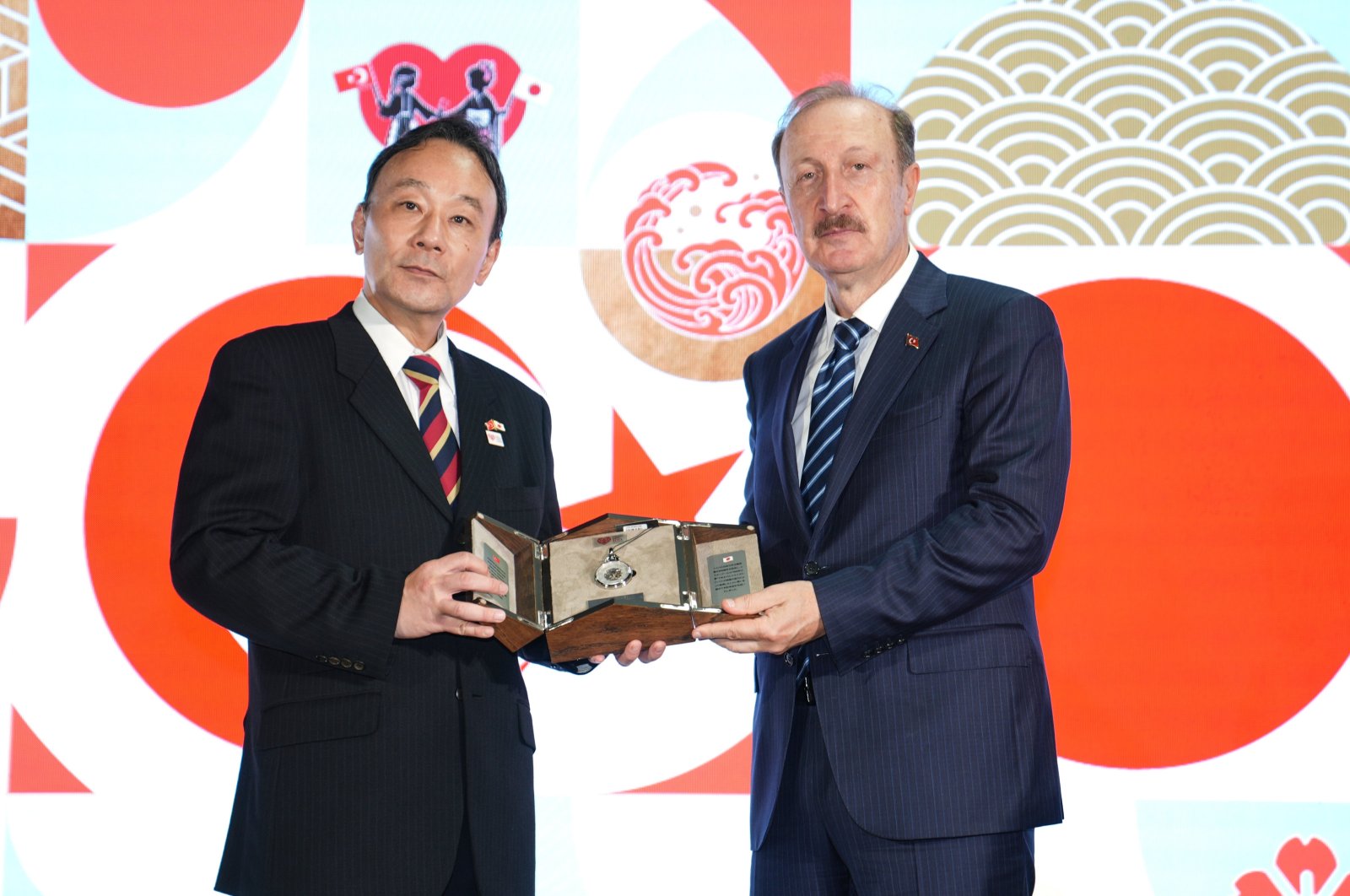 Enver Iskurt, Türkiye&#039;s deputy transport and infrastructure minister (R), presents a gift to Japan&#039;s Ambassador to Ankara Katsumata Takahiko (L), during a ceremony to celebrate the centenary of Turkish-Japanese diplomatic relations in Istanbul, Türkiye, Sept. 29, 2024. (AA Photo)