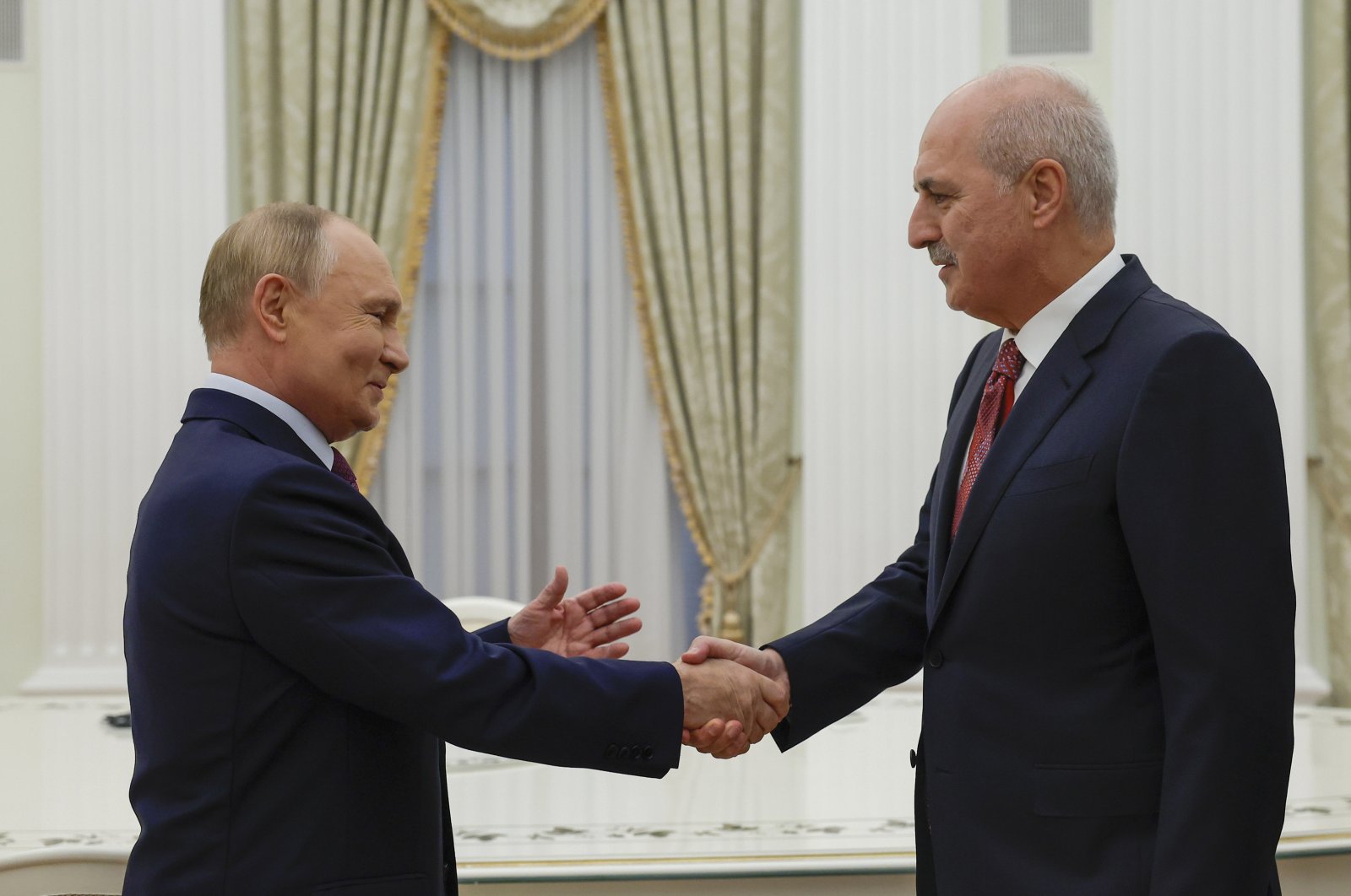 Russian President Vladimir Putin (L) shakes hands with Parliament Speaker Numan Kurtulmuş during a meeting at the Kremlin, Moscow, Russia, Sept. 25, 2024. (EPA Photo)