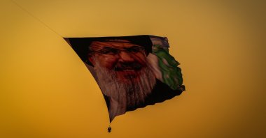 A ceremonial flight featuring a poster of the slain Hezbollah leader Hassan Nasrallah takes place in Baghdad, Iraq, Sept. 30, 2024. (AA Photo)