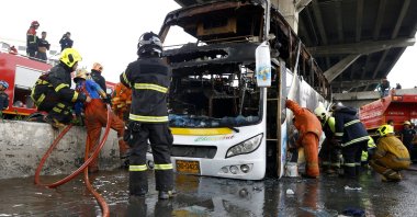 First response teams inspect a bus that burnt after a likely gas leak, in Bangkok, Thailand, Oct. 1, 2024. (EPA Photo)