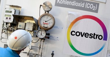 An employee of chemical company Covestro AG checks a tank for carbon dioxide at their plant in Dormagen, Germany, Feb. 11, 2020. (AFP Photo)