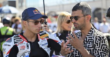 Turkish rider Toprak Razgatlıoğlu (L) and coach Kenan Sofuoğlu at the Aragon round of the 2024 FIM Superbike World Championship, Alcaniz, Spain, Sept. 29, 2024. (AA Photo)