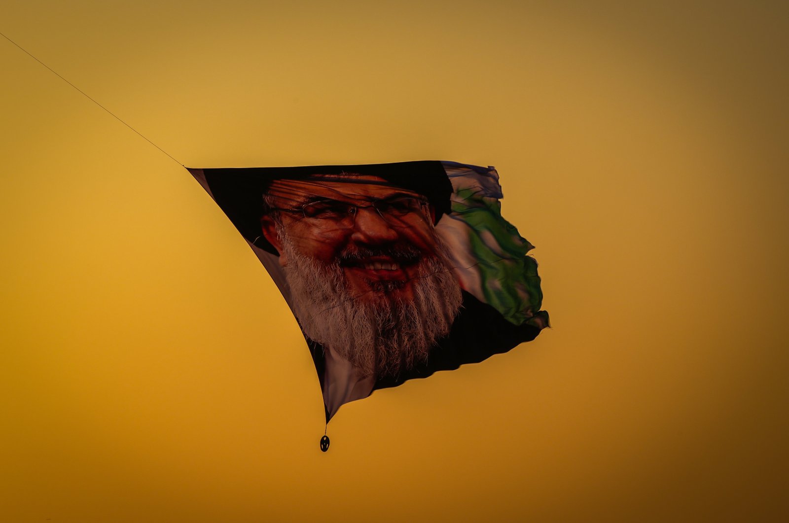 A ceremonial flight featuring a poster of the slain Hezbollah leader Hassan Nasrallah takes place in Baghdad, Iraq, Sept. 30, 2024. (AA Photo)