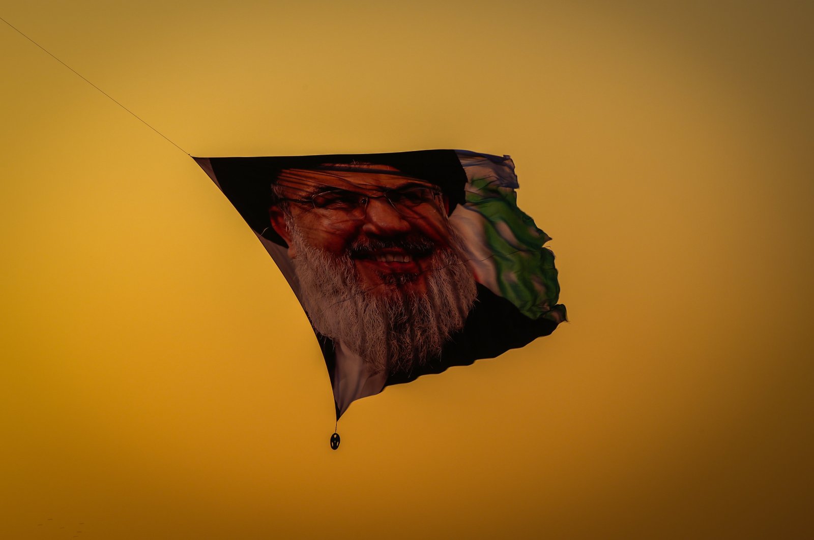 A ceremonial flight featuring a poster of the slain Hezbollah leader Hassan Nasrallah takes place in Baghdad, Iraq, Sept. 30, 2024. (AA Photo)