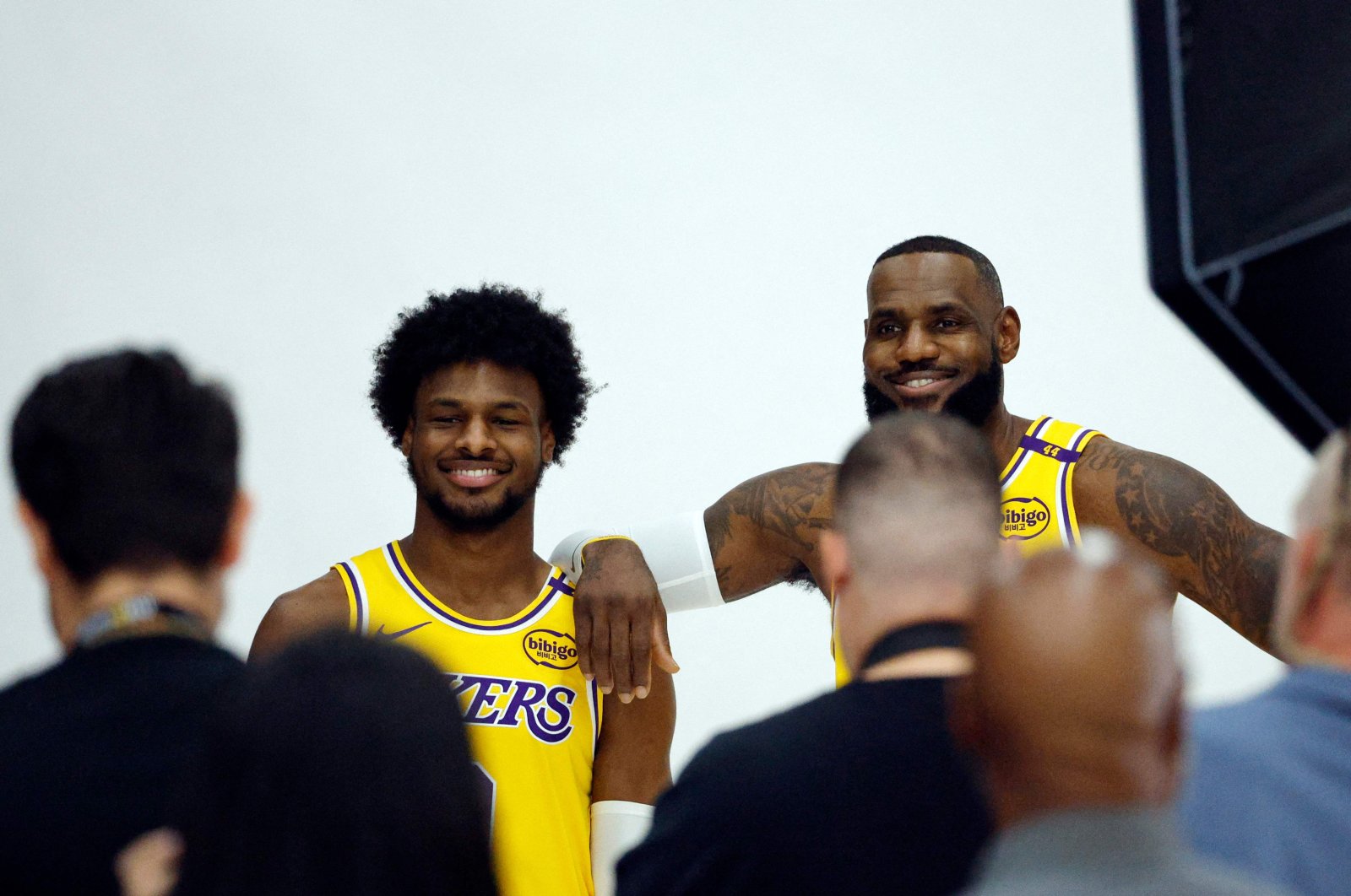 Los Angeles Lakers&#039; LeBron James (R) and his son Bronny James Jr. attend a Los Angeles Lakers media day at UCLA Health Training Center, El Segundo, California, U.S., Sept. 30, 2024. (AFP Photo)