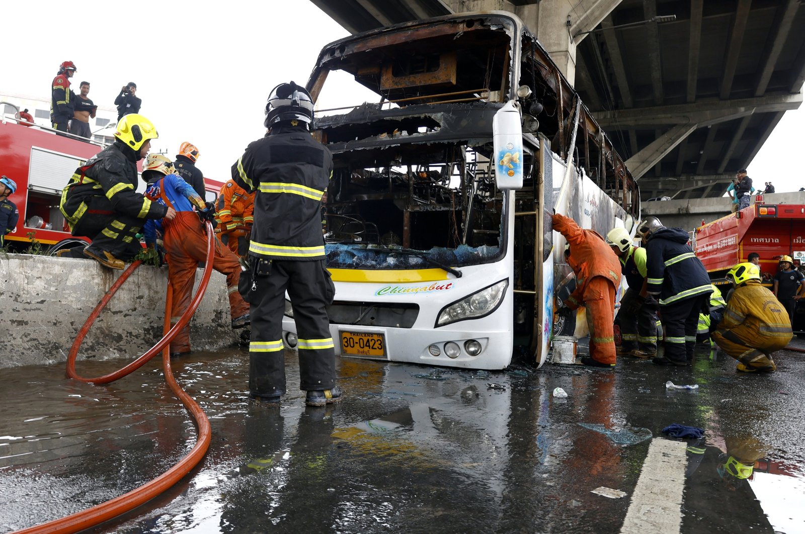 First response teams inspect a bus that burnt after a likely gas leak, in Bangkok, Thailand, Oct. 1, 2024. (EPA Photo)