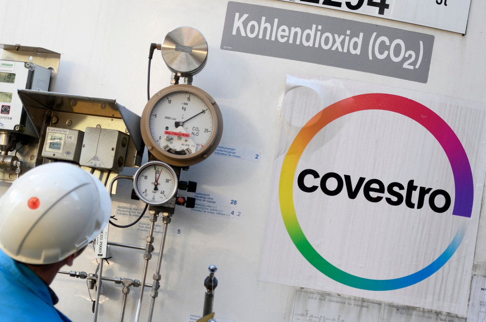 An employee of chemical company Covestro AG checks a tank for carbon dioxide at their plant in Dormagen, Germany, Feb. 11, 2020. (AFP Photo)