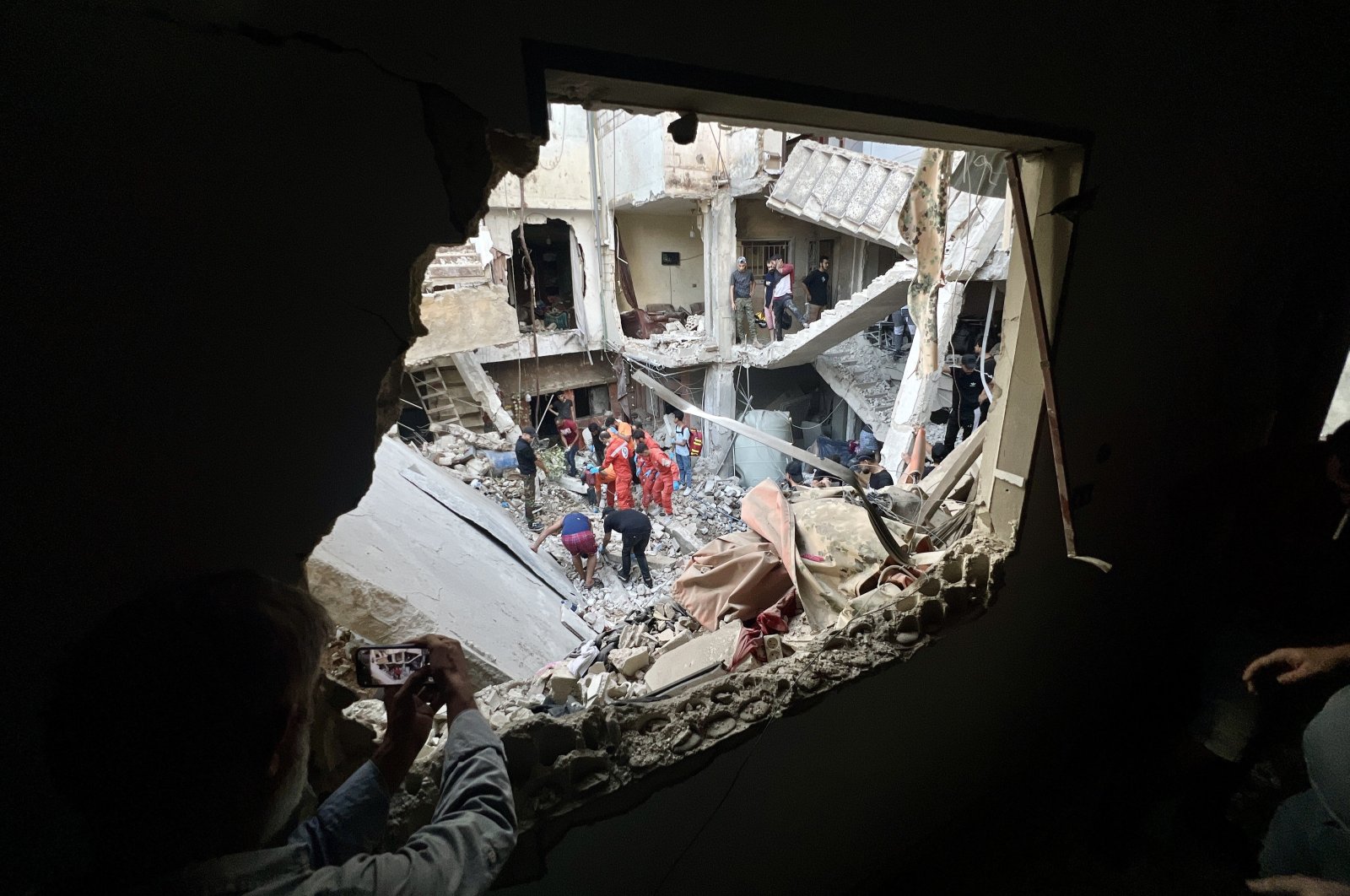 Search and rescue team members try to find victims following an overnight raid by the Israeli army on the Palestinian camp of Ain Al Hilweh, in Sidon, Lebanon, Oct. 1, 2024. (EPA Photo)