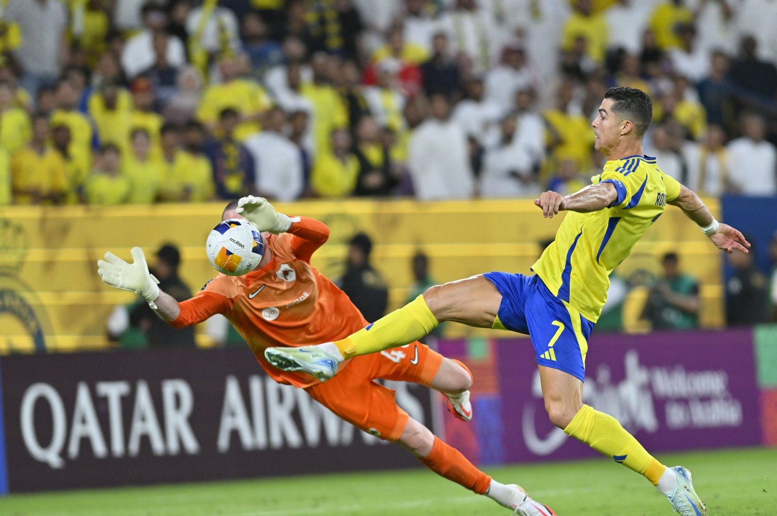 Al-Nassr&#039;s Cristiano Ronaldo (R) scores during the AFC Champions League Group B match against Qatar&#039;s Al-Rayyan at the Alawwal Park Stadium, Riyadh, Saudi Arabia, Sept. 30, 2024. (AA Photo)