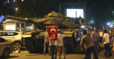 People resist FETÖ&#039;s putschists in a tank during the coup attempt in the capital of Ankara, Türkiye, July 16, 2016. (AP Photo)