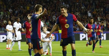 FC Barcelona's Robert Lewandowski (R) celebrates with Inigo Martinez after scoring during the Champions League match against Young Boys at the Estadi Olimpic Lluis Companys, Barcelona, Spain, Oct. 1, 2024. (Reuters Photo) 