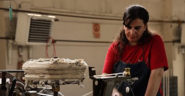 One of the employees working on the thread-producing machine, Diyarbakır, Türkiye, Oct. 2, 2024. (IHA Photo)