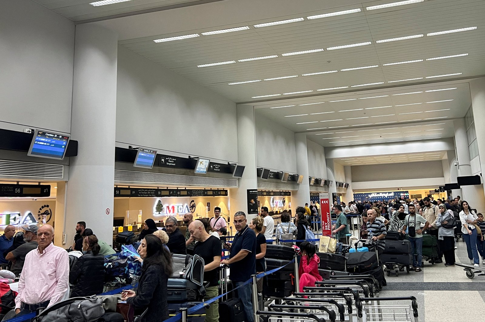 Passengers line up at the check-in counters at Beirut-Rafic Al Hariri International Airport, Beirut, Lebanon, Oct. 2, 2024. (Reuters Photo)