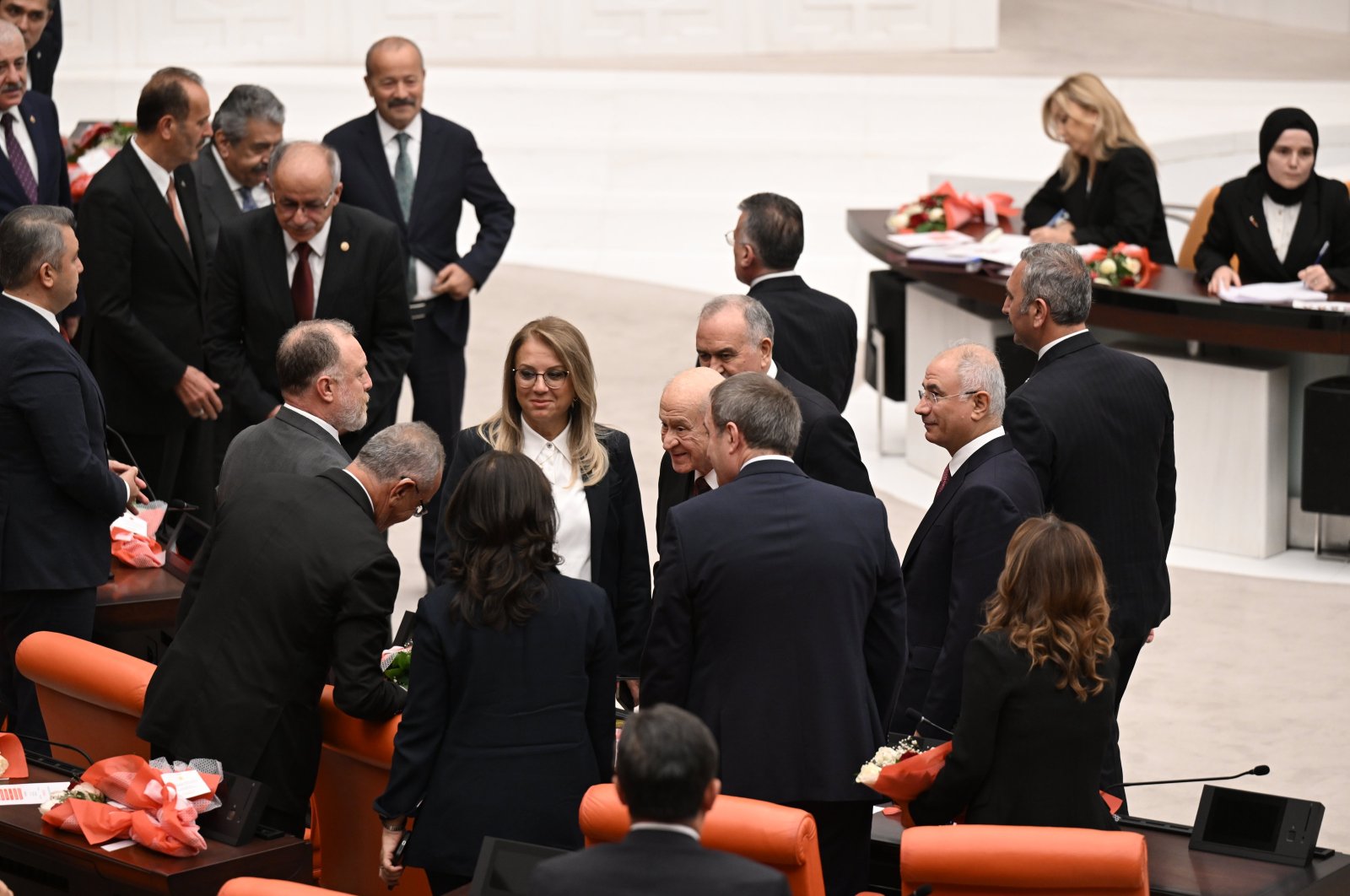 MHP Chair Devlet Bahçeli and DEM Party lawmakers shake hands at Parliament, Ankara, Türkiye, Oct. 2, 2024. (AA Photo)