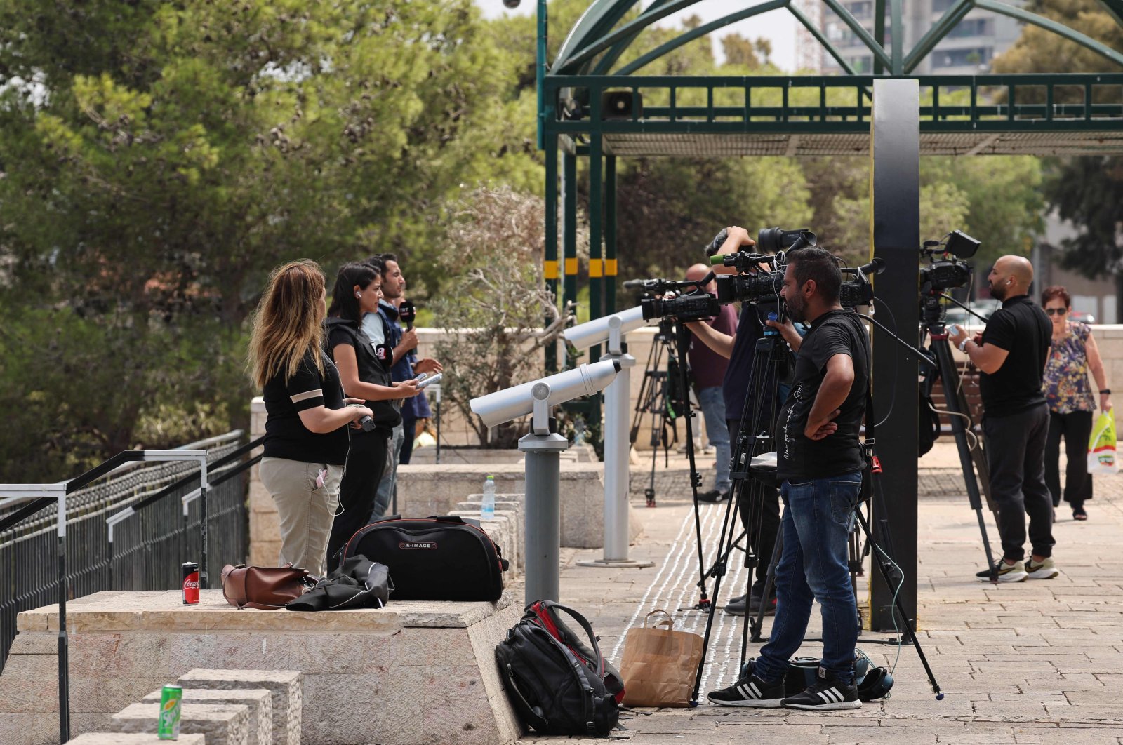 Journalists report from an area overlooking the port of the northern city of Haifa, Israel, Sept. 25, 2024. (AFP Photo) 