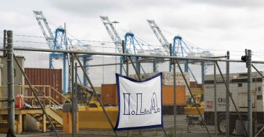 A banner for the International Longshoremen&#039;s Association hangs on the fence outside the Packer Marine Terminal in Philadelphia, Pennsylvania, U.S., Oct. 1, 2024. (AFP Photo)