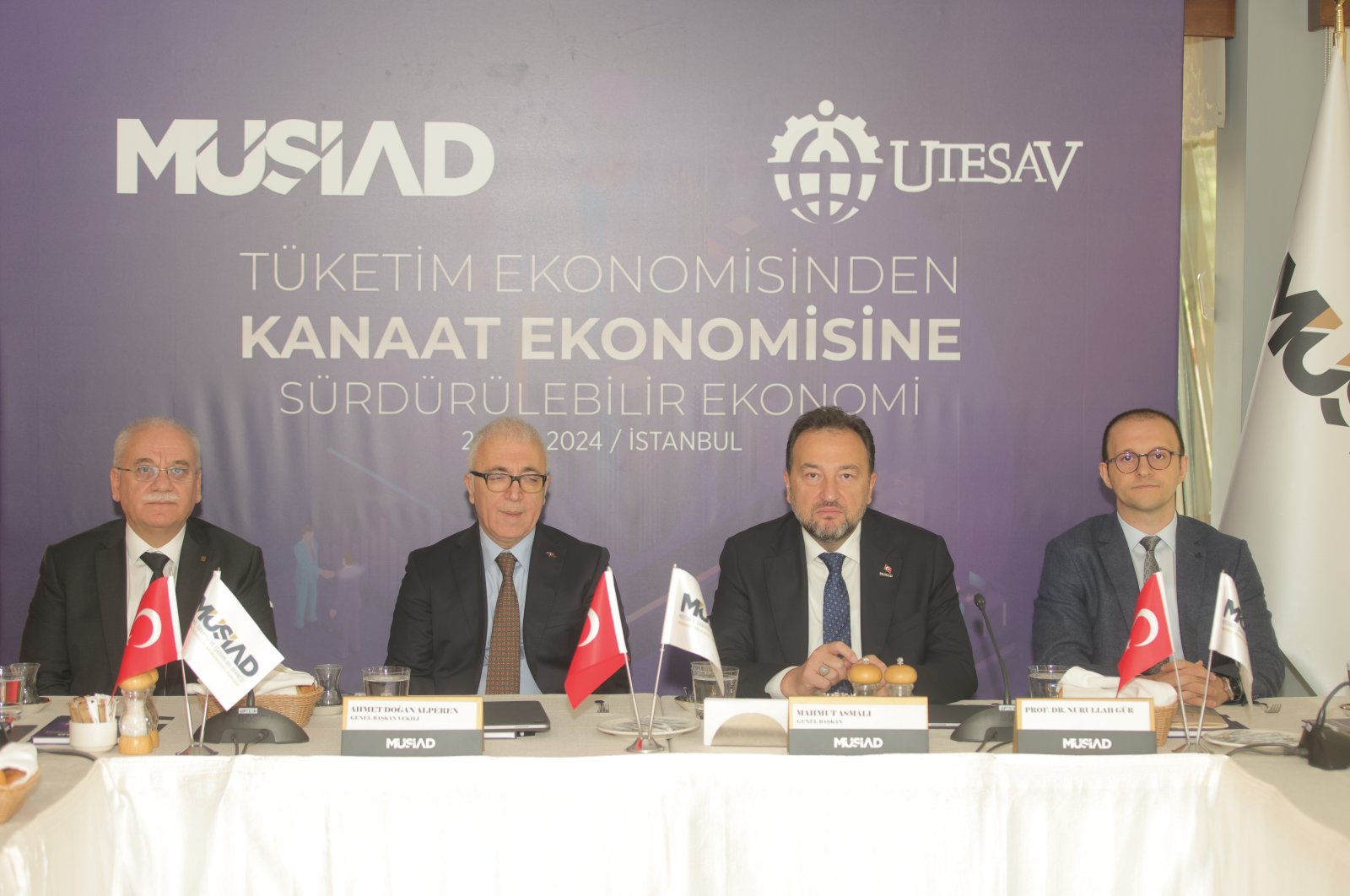 UTESAV President Ahmet Doğan Alperen (2-L), MÜSIAD President Mahmut Asmalı (2-R) and professor Nurullah Gür (R) present the report, Istanbul, Türkiye, Oct. 2, 2024. (Courtesy of MÜSIAD)