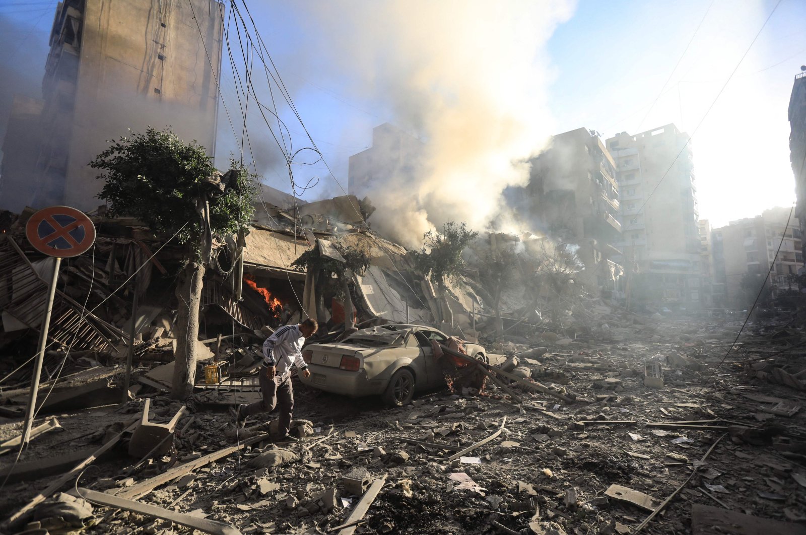 A man walks amid the rubble of a building hit in an overnight Israeli airstrike in Beirut, Lebanon, Oct. 3, 2024. (AFP Photo)