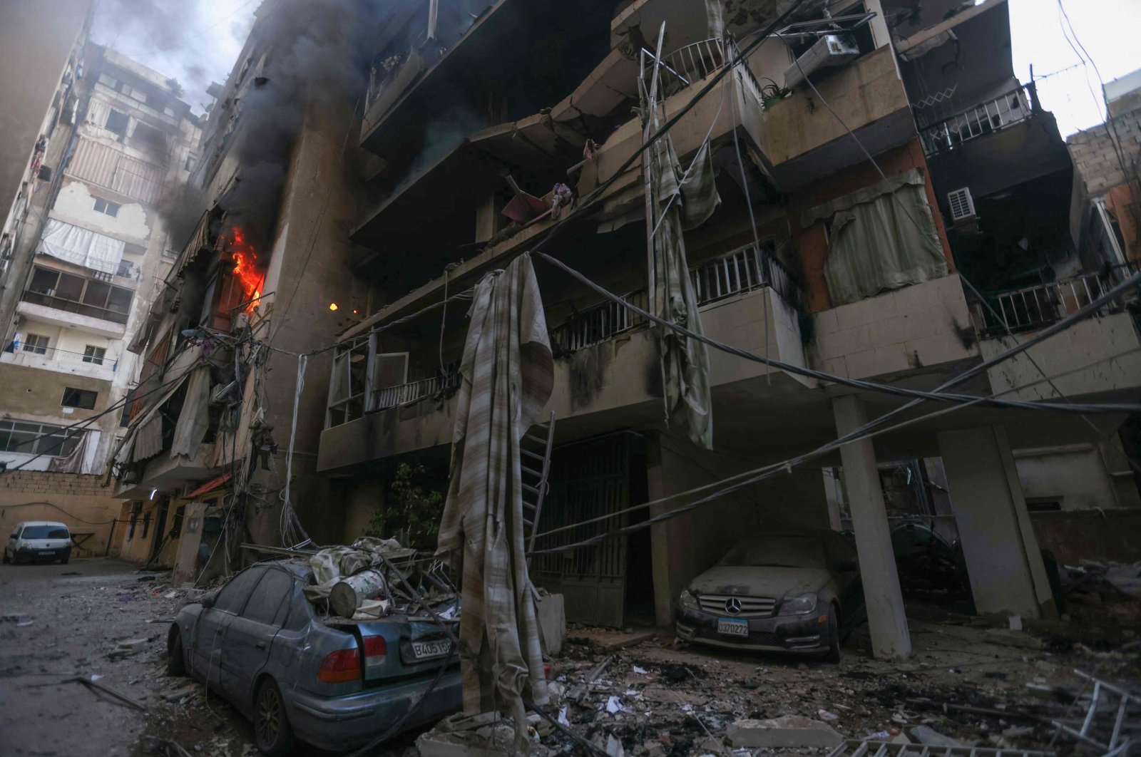 A fire burns in a damaged building at the site of overnight Israeli airstrikes on the Chiah neighborhood, Beirut, Lebanon, Oct. 4, 2024. (AFP Photo)