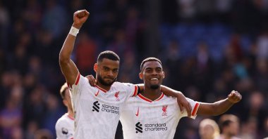 Liverpool's Cody Gakpo and Liverpool's Ryan Gravenberch celebrate after a Premier League match against Crystal Palace, London, U.K., Oct. 5, 2024.