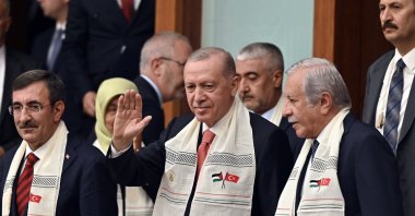 President Recep Tayyip Erdoğan, wearing a scarf embroidered with Turkish and Palestinian flags, greets the attendees upon his arrival to Parliament to listen to Palestinian President Mahmoud Abbas&#039; speech, Ankara, Türkiye, Aug. 15, 2024. (AP Photo)