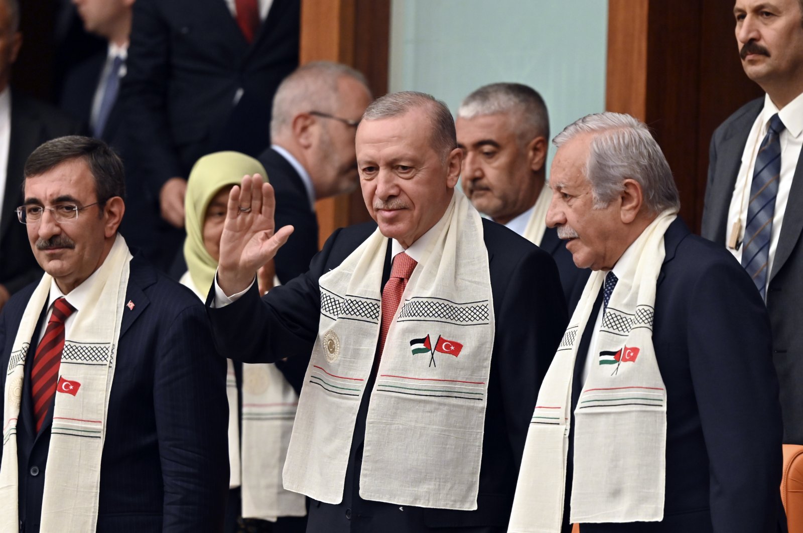 President Recep Tayyip Erdoğan, wearing a scarf embroidered with Turkish and Palestinian flags, greets the attendees upon his arrival to Parliament to listen to Palestinian President Mahmoud Abbas&#039; speech, Ankara, Türkiye, Aug. 15, 2024. (AP Photo)